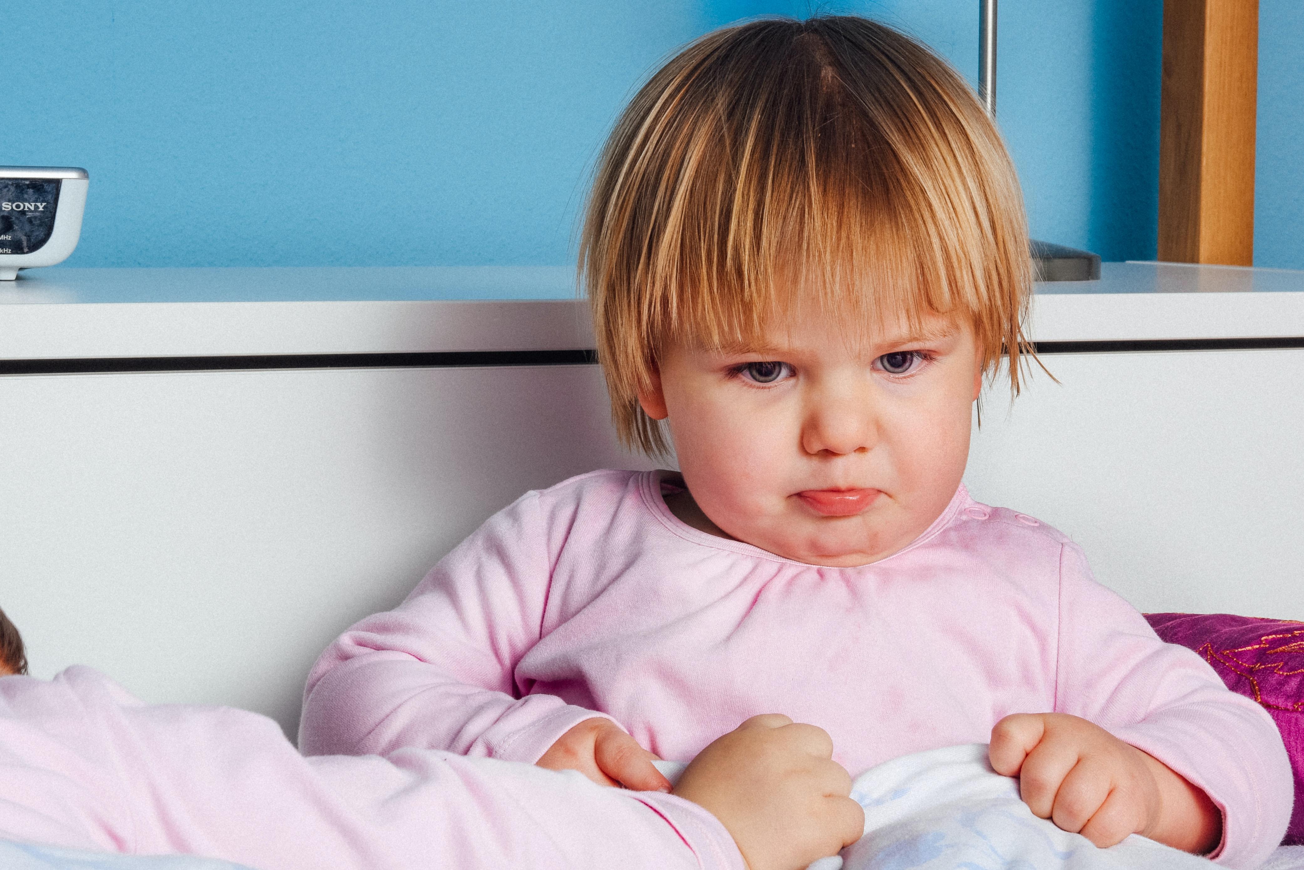 Child in pink top.